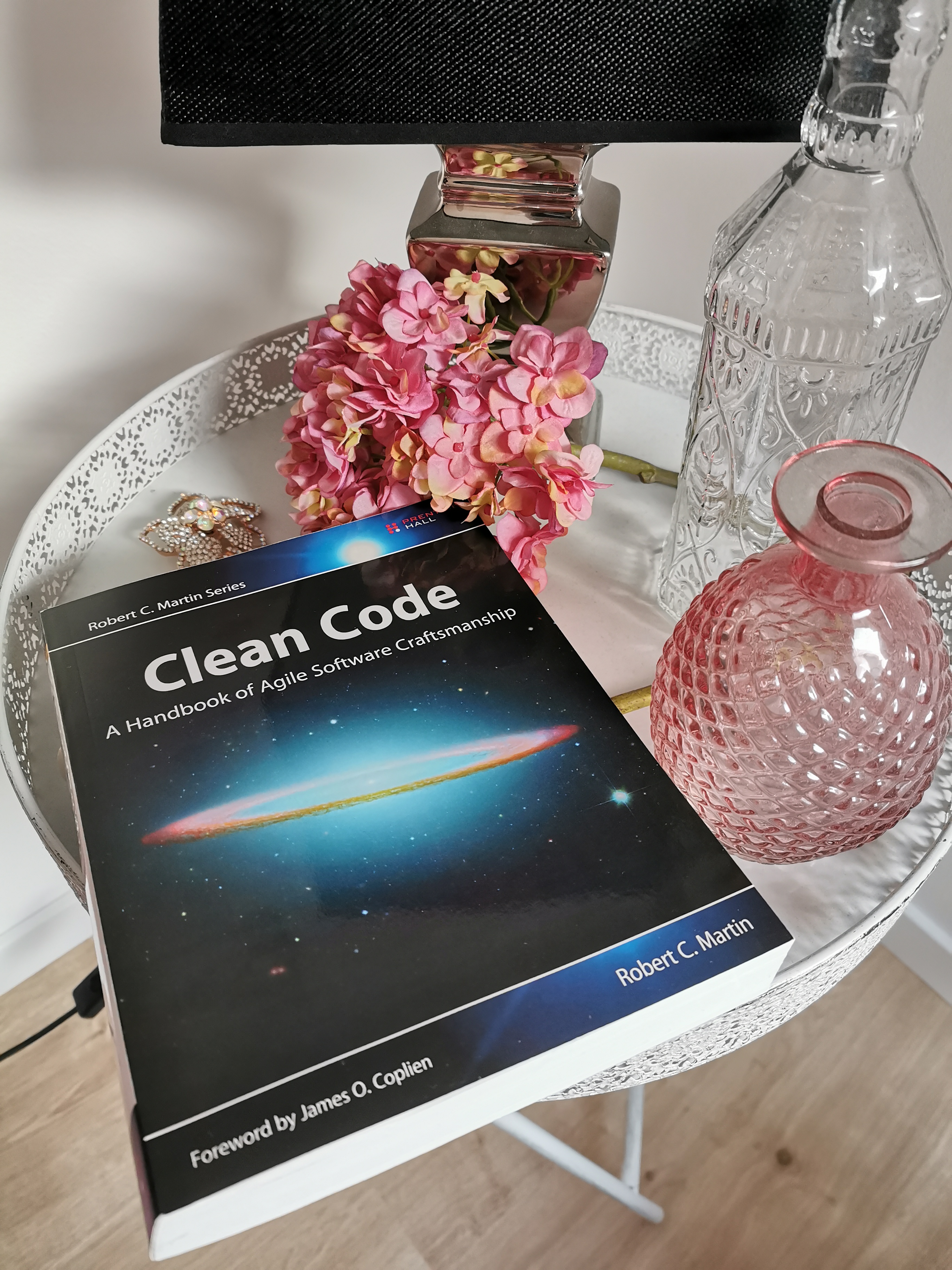 The book “Clean Code - A Handbook of Agile Software Craftsmanship” on a coffee table